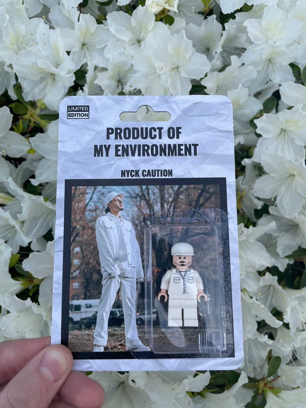 NYCK CAUTION "PRODUCT OF MY ENVIRONMENT" FIGURE